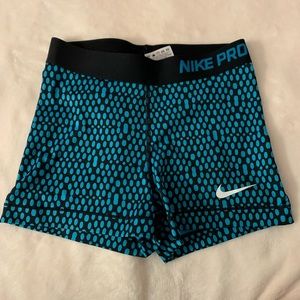 women’s size small blue and black dotted Nike Pros